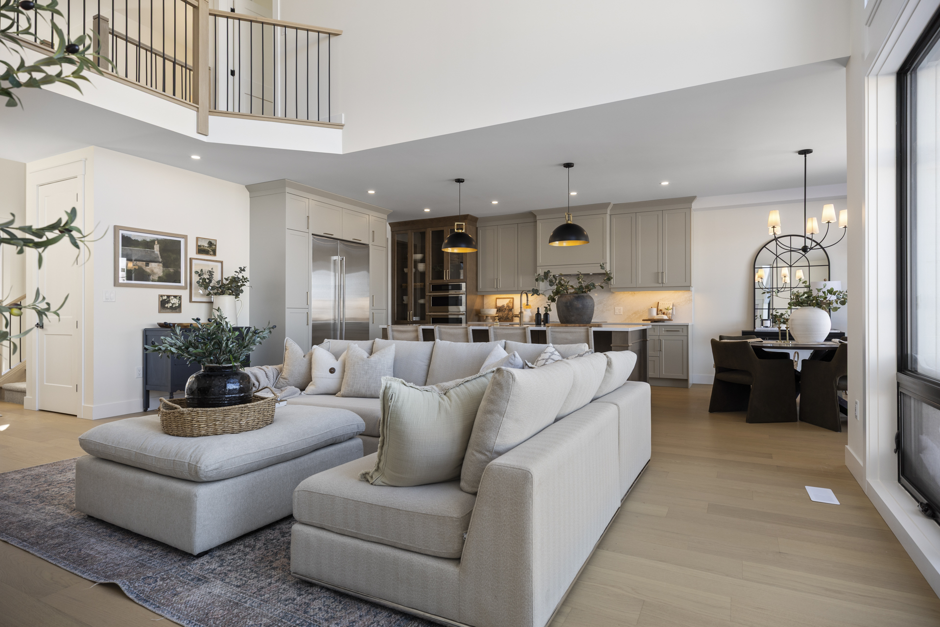 Open-concept living room with double-height ceiling